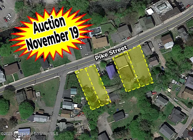 an aerial view of a house with a swimming pool