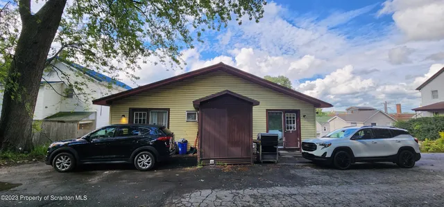 a car parked in front of a house