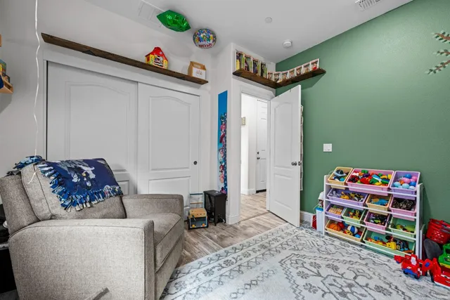 wooden floor in a hall with an empty room