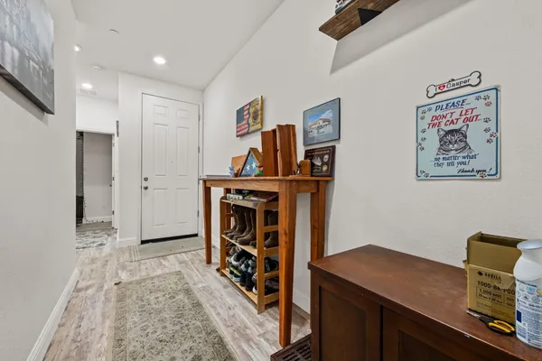 a living room with furniture and a book shelf