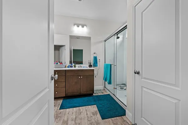 a bathroom with a double vanity sink and a mirror