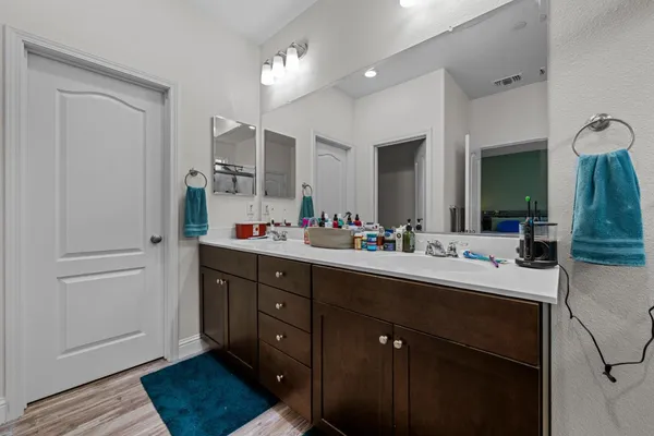 a white toilet sitting next to a shower