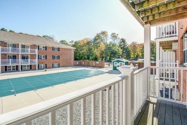 79 Leonard Road, Unit 79 Boxborough, MA 01719 - Photo 12 of 16 a view of a house with backyard and porch