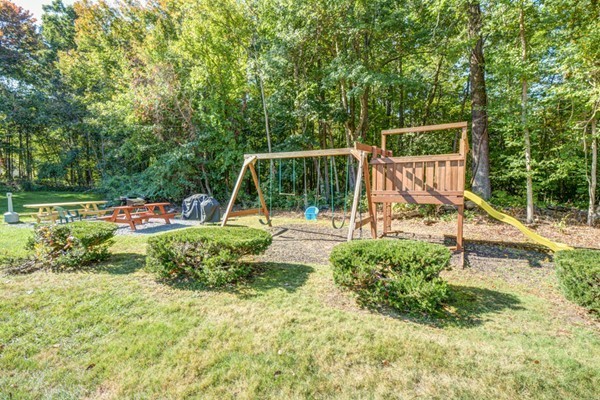 79 Leonard Road, Unit 79 Boxborough, MA 01719 - Photo 14 of 16 a view of a park with slide