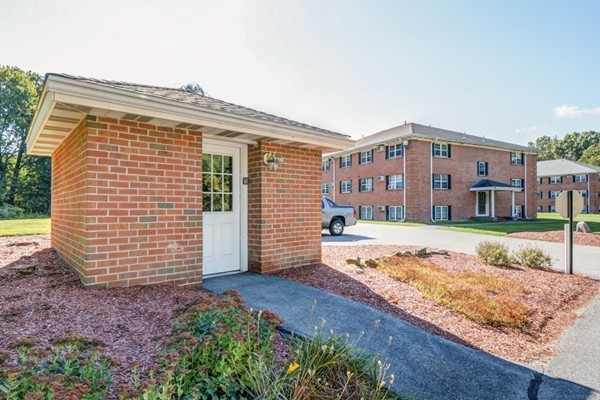 79 Leonard Road, Unit 79 Boxborough, MA 01719 - Photo 15 of 16 a front view of house with yard