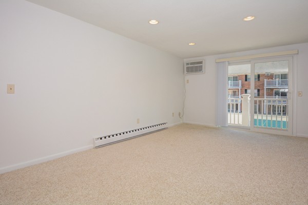 79 Leonard Road, Unit 79 Boxborough, MA 01719 - Photo 8 of 16 an empty room with windows