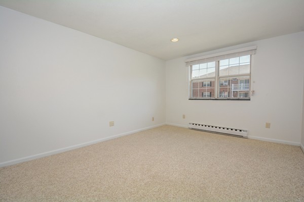 79 Leonard Road, Unit 79 Boxborough, MA 01719 - Photo 9 of 16 an empty room with a window