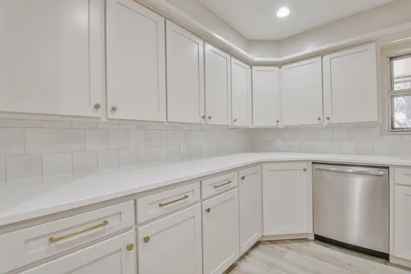 a view of cabinets and window