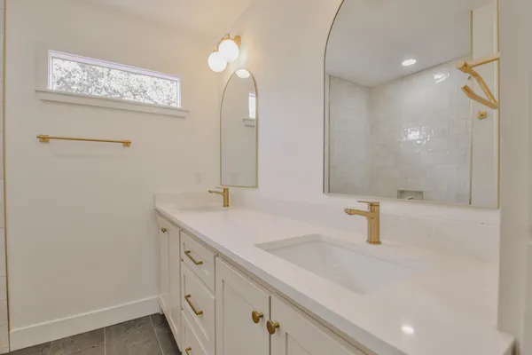 a bathroom with a sink and a mirror