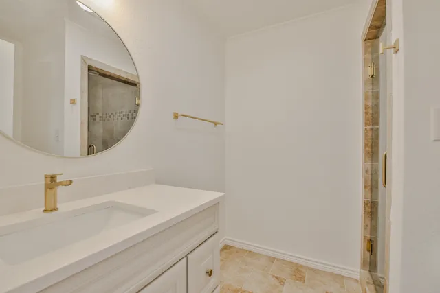 a bathroom with a sink and a mirror