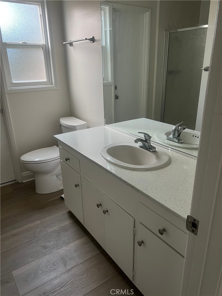 8721 Squires Circle Huntington Beach, CA 92646 - Photo 15 of 43 a bathroom with a toilet sink and mirror