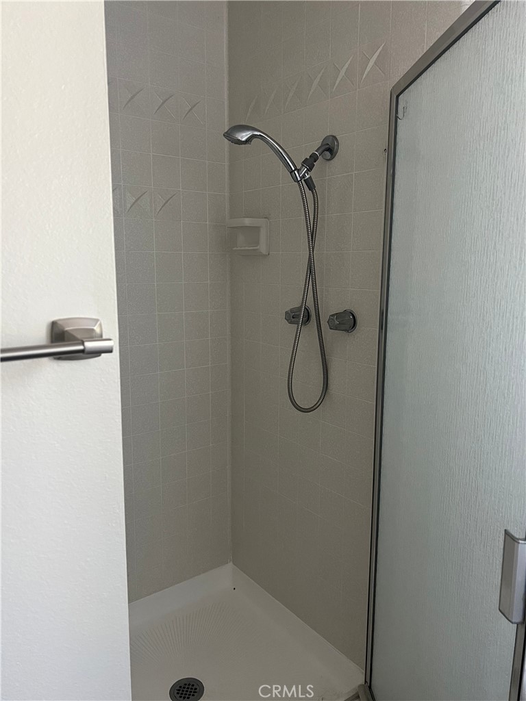 8721 Squires Circle Huntington Beach, CA 92646 - Photo 17 of 43 a bathroom with a shower
