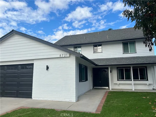 a house view with a garden space