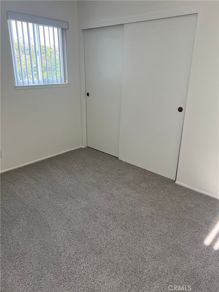 8721 Squires Circle Huntington Beach, CA 92646 - Photo 24 of 43 an empty room with windows