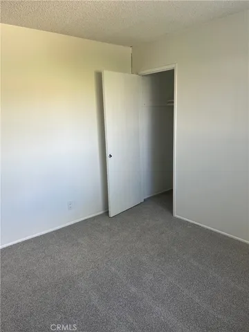 a view of a hallway to rooms