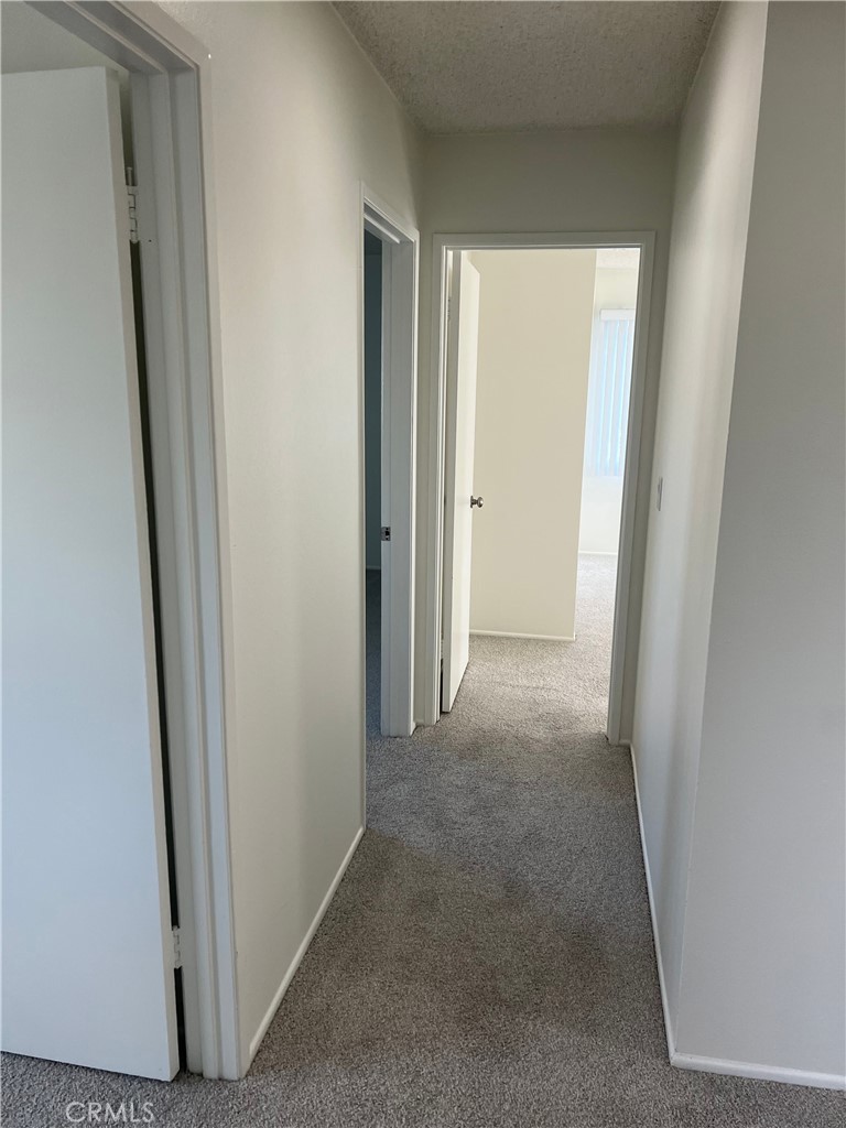 8721 Squires Circle Huntington Beach, CA 92646 - Photo 29 of 43 a view of a hallway to rooms