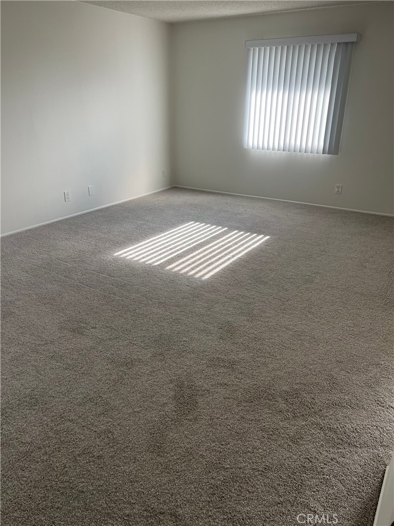 8721 Squires Circle Huntington Beach, CA 92646 - Photo 33 of 43 an empty room with windows