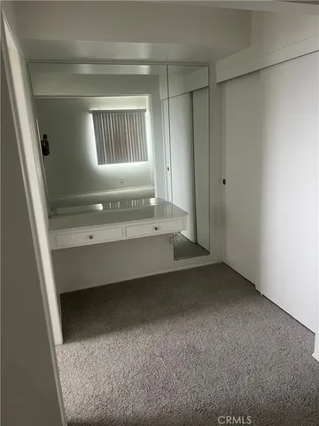 a front view of a house with large windows