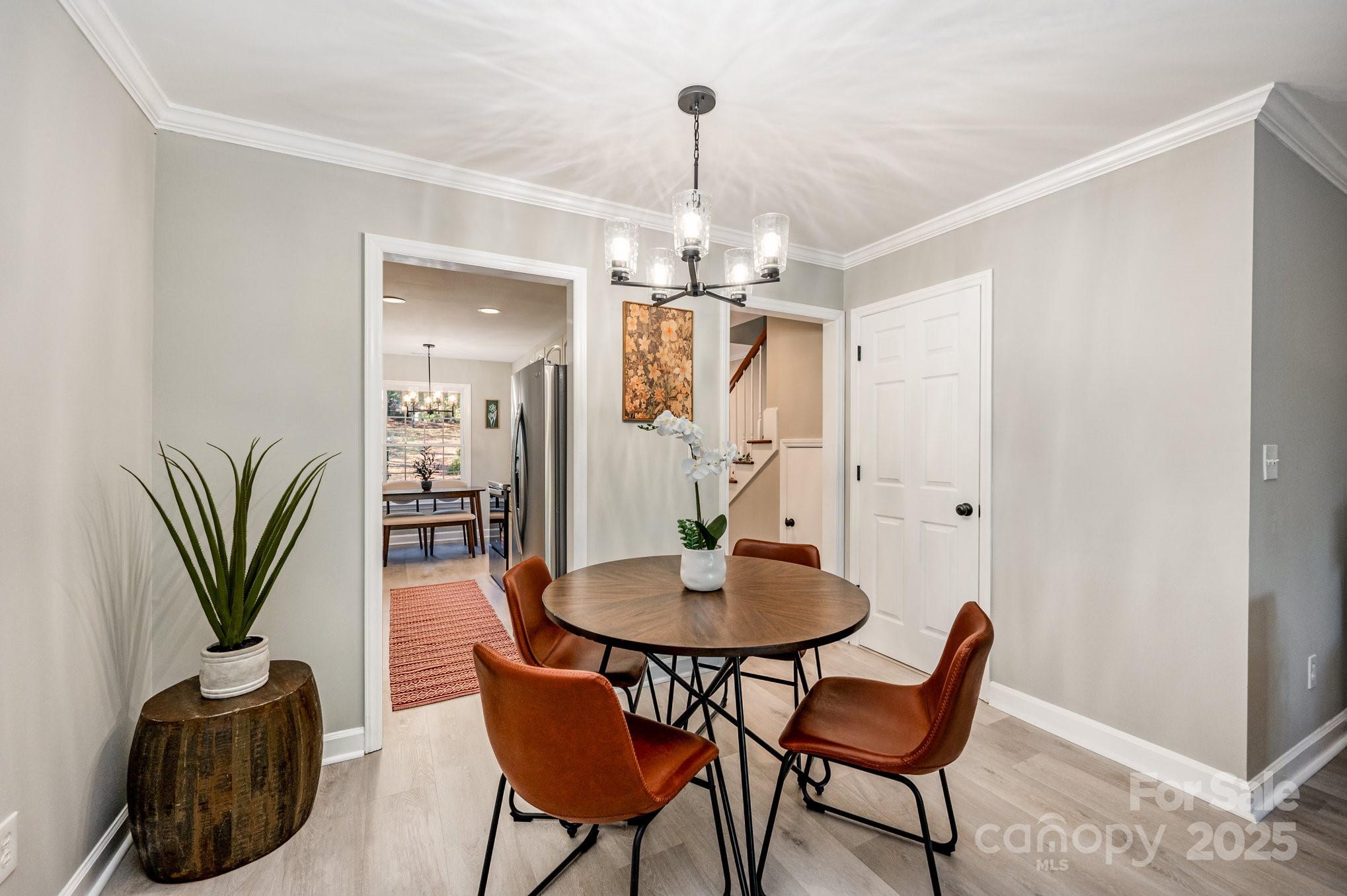 7047 Quail Hill Road Charlotte, NC 28210 - Photo 11 of 29 a view of a dining room with furniture and wooden floor