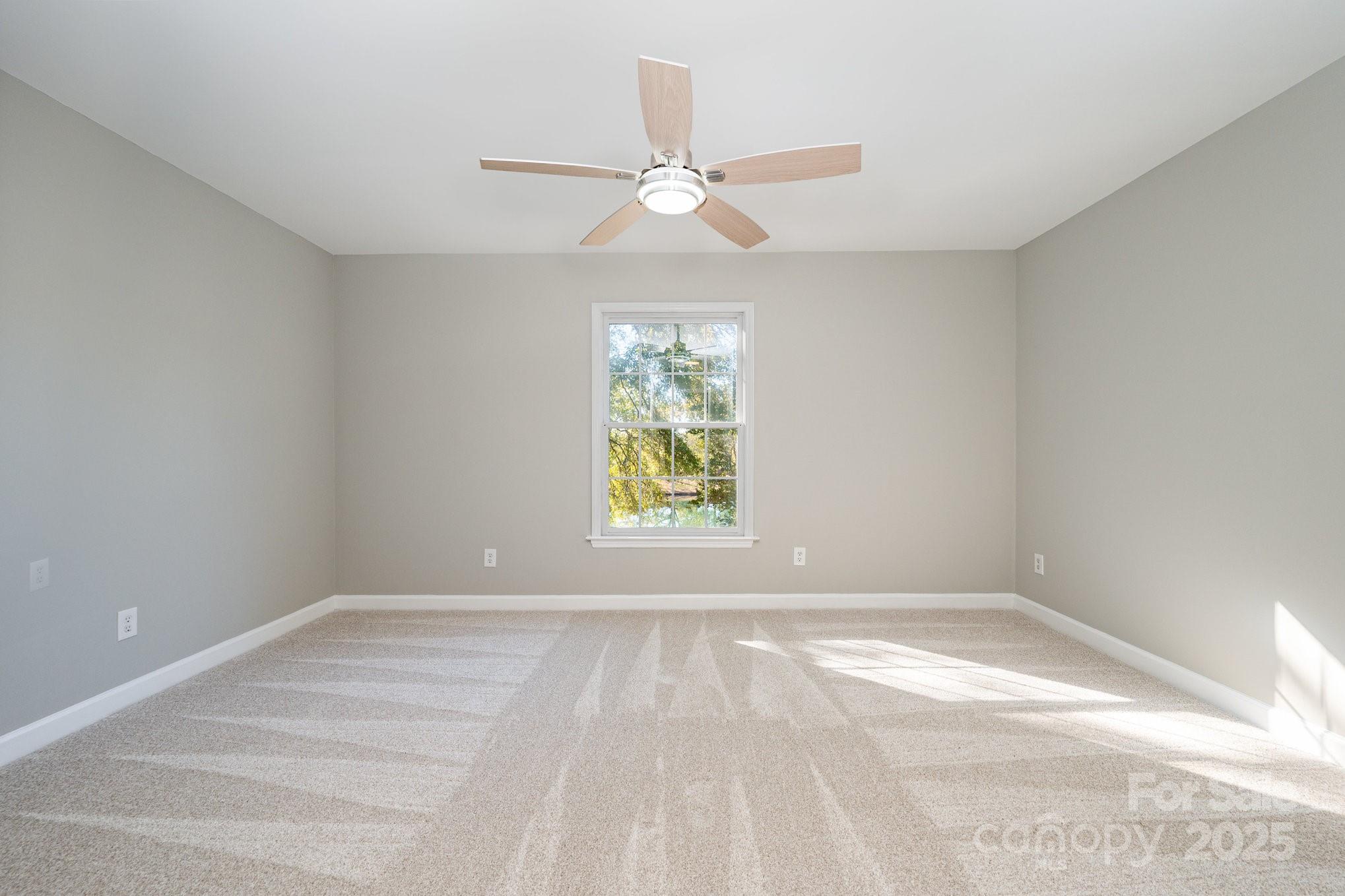 7047 Quail Hill Road Charlotte, NC 28210 - Photo 17 of 29 a view of room with window and ceiling fan