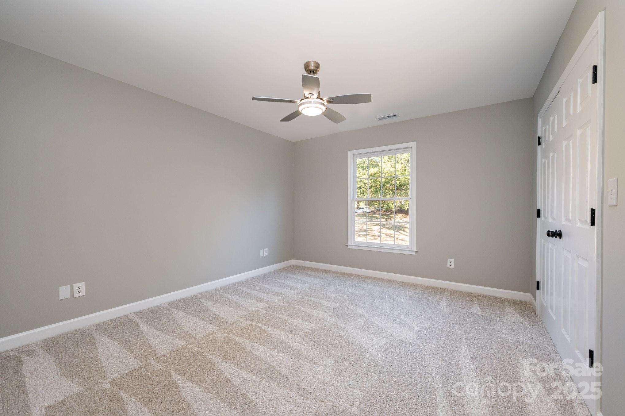 7047 Quail Hill Road Charlotte, NC 28210 - Photo 20 of 29 a view of an empty room with a window