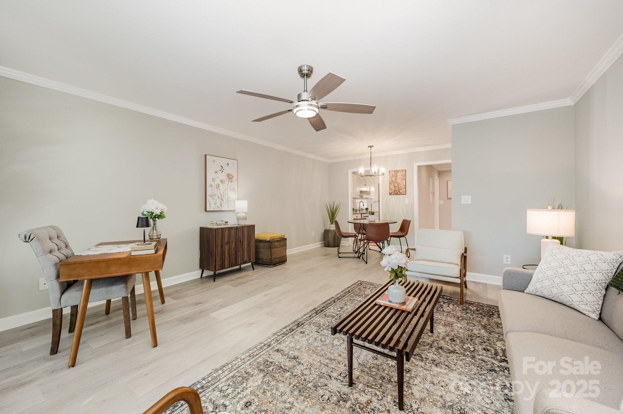 7047 Quail Hill Road Charlotte, NC 28210 - Photo 8 of 29 a living room with furniture and a rug