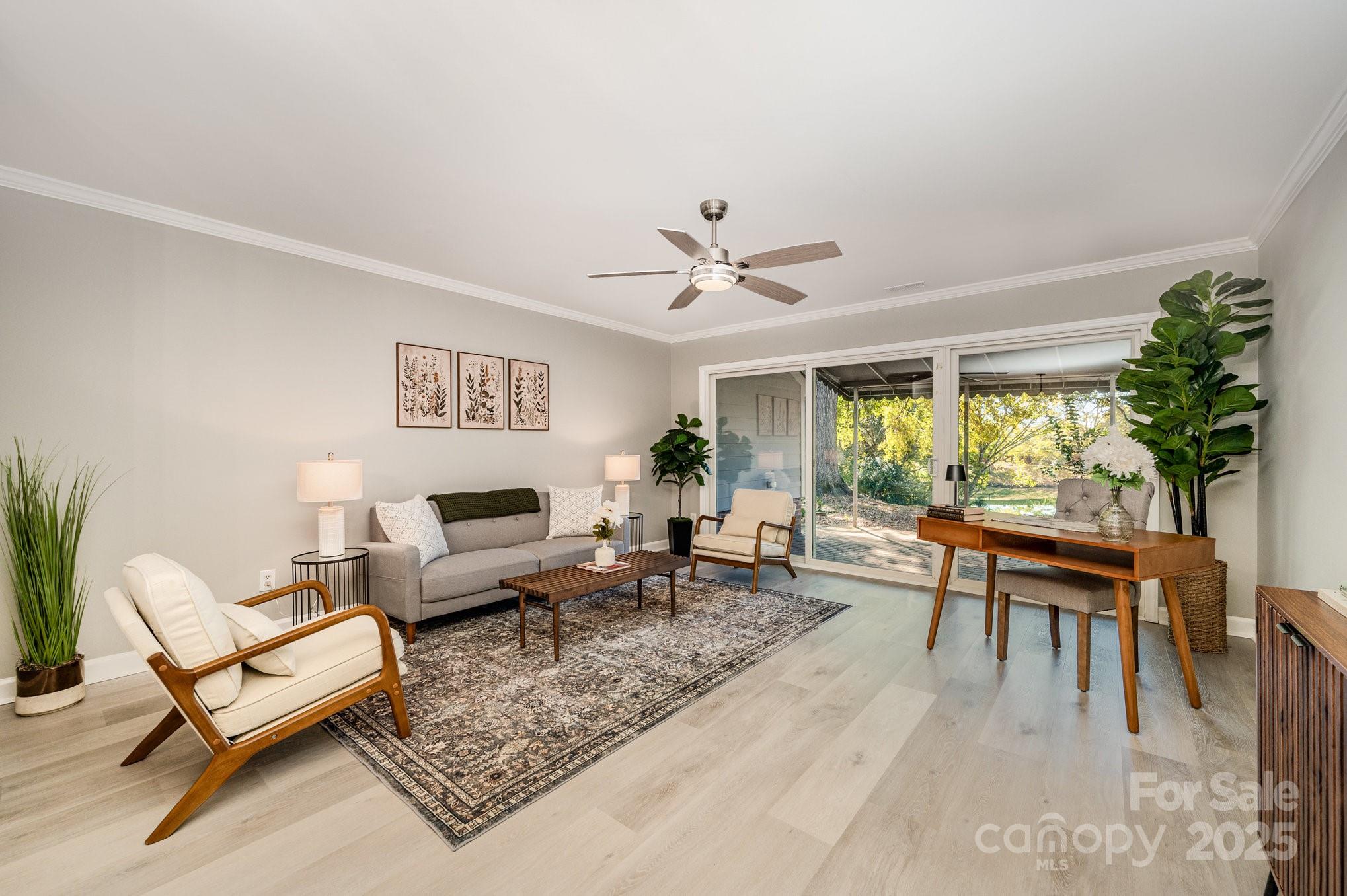 7047 Quail Hill Road Charlotte, NC 28210 - Photo 9 of 29 a living room with furniture a table and a large window