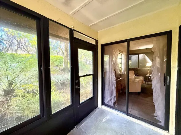 a view of living room with furniture and floor to ceiling window