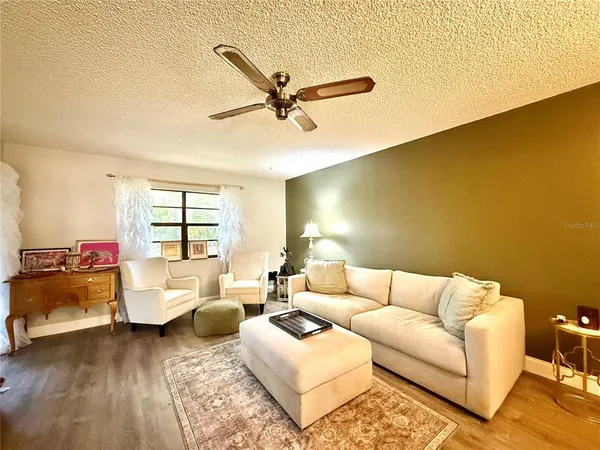 a living room with furniture and a window