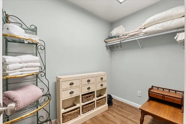 a view of an empty room with racks on the wall