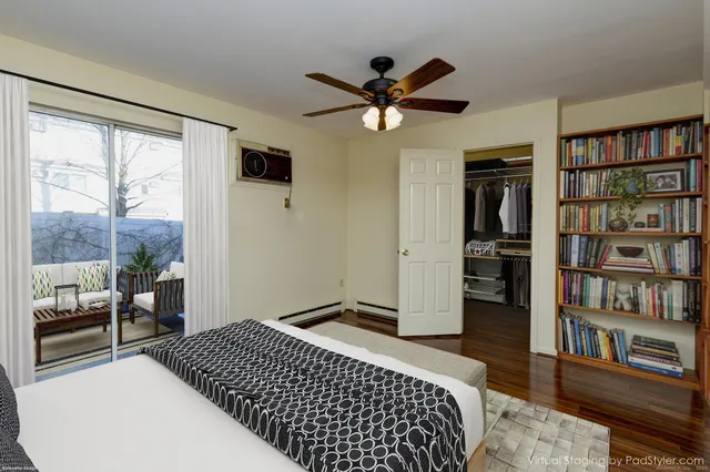 a bedroom with furniture and a book shelf