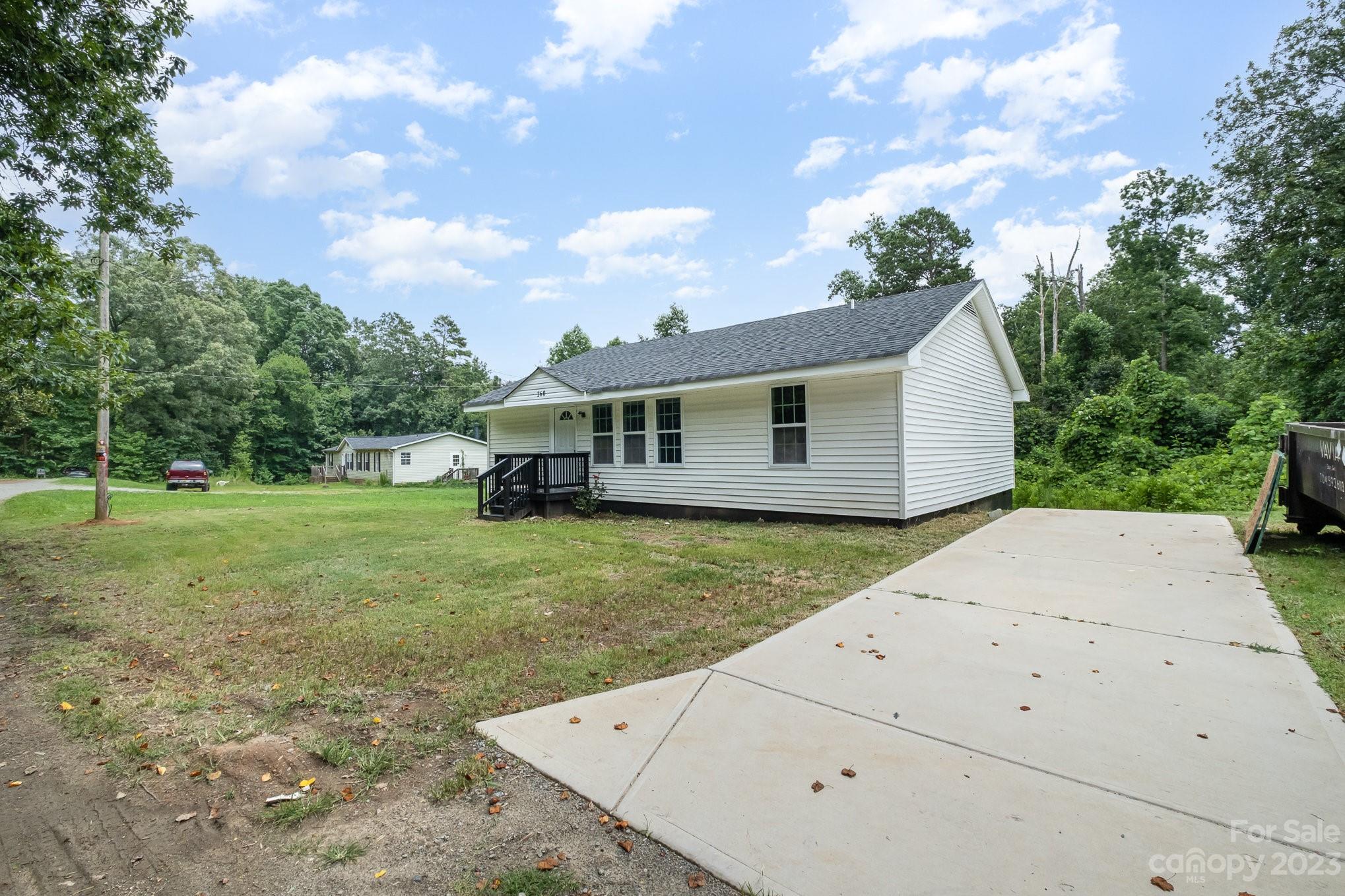 260 Upper Stanley Road Stanley, NC 28164 - Photo 2 of 18 a view of a house with a backyard