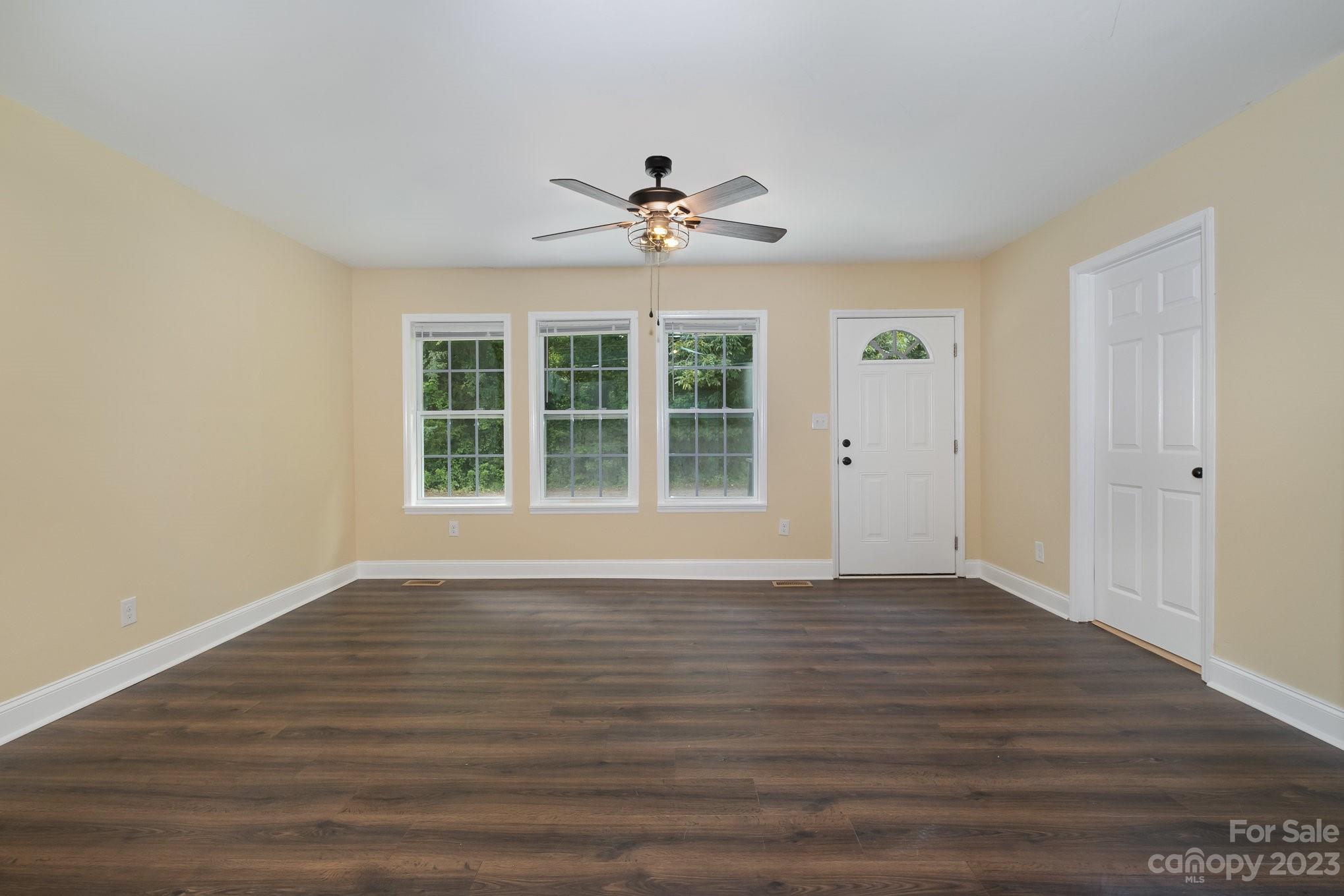260 Upper Stanley Road Stanley, NC 28164 - Photo 3 of 18 a view of an empty room with window and wooden floor