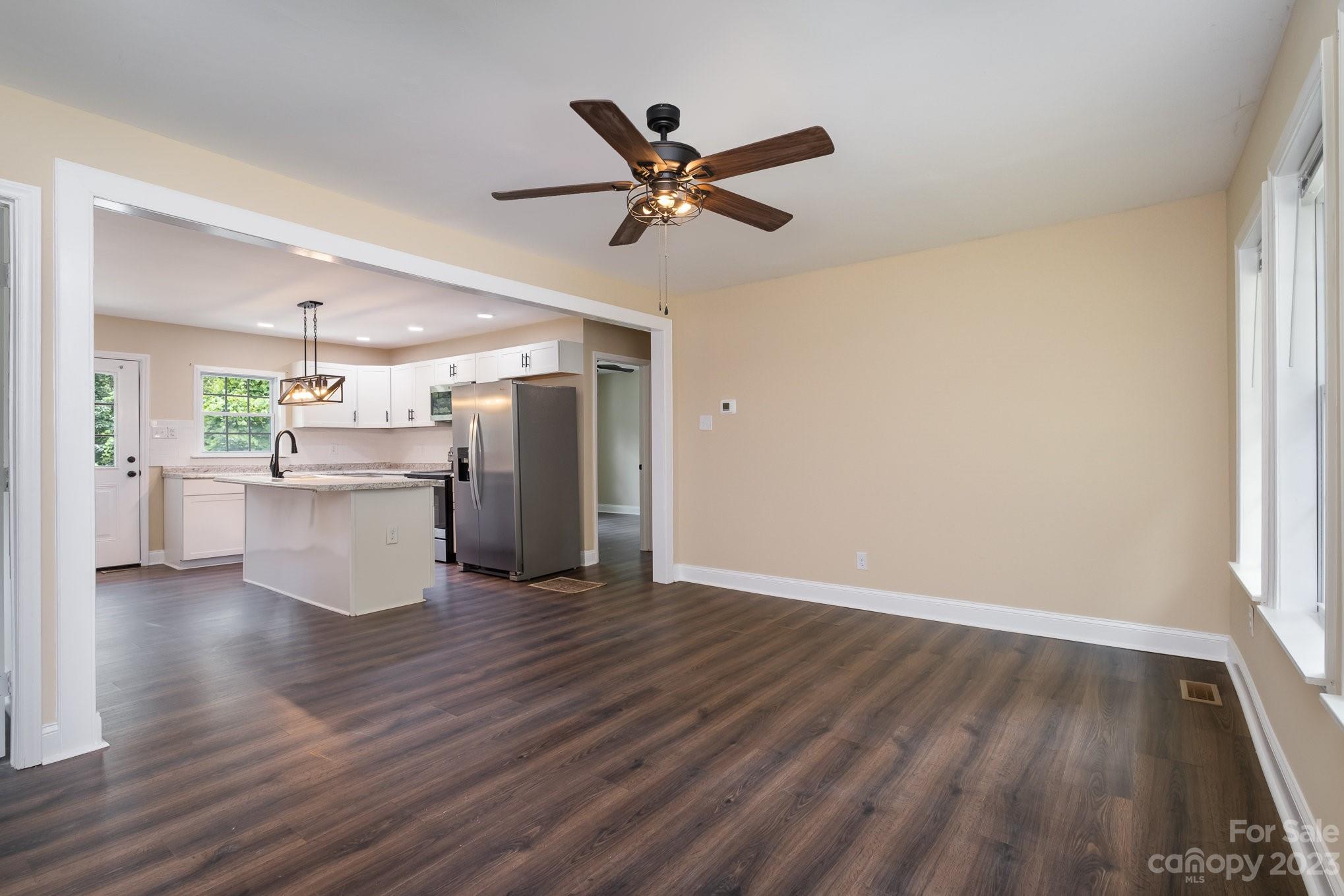 260 Upper Stanley Road Stanley, NC 28164 - Photo 4 of 18 a view of an empty room with window and wooden floor