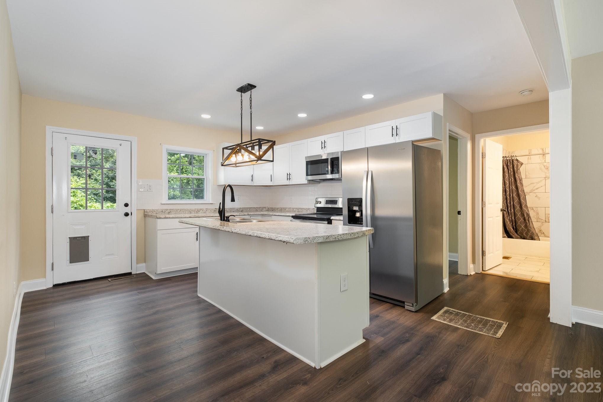 260 Upper Stanley Road Stanley, NC 28164 - Photo 6 of 18 a kitchen with stainless steel appliances a refrigerator sink and microwave