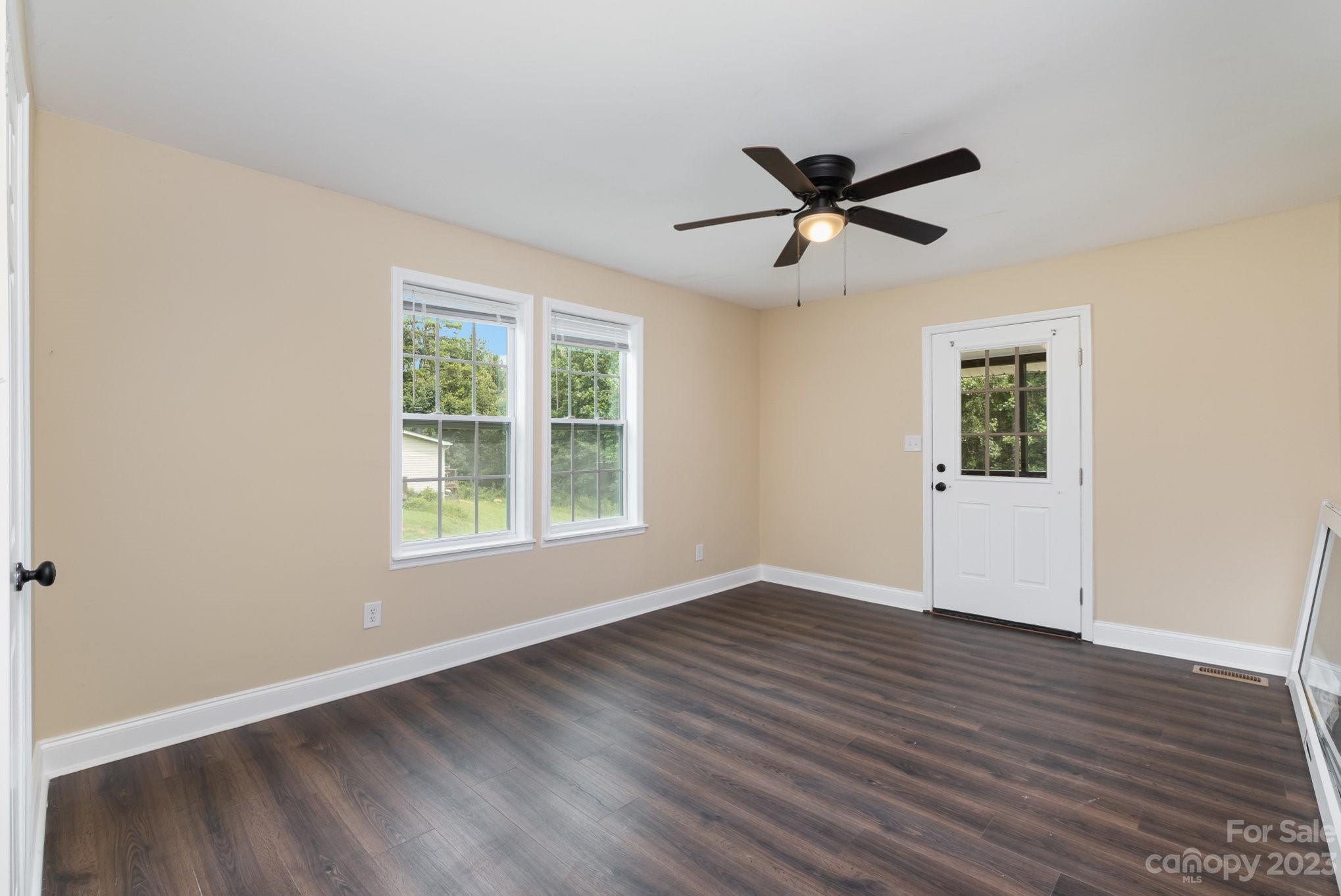 260 Upper Stanley Road Stanley, NC 28164 - Photo 9 of 18 a view of an empty room with wooden floor and a window