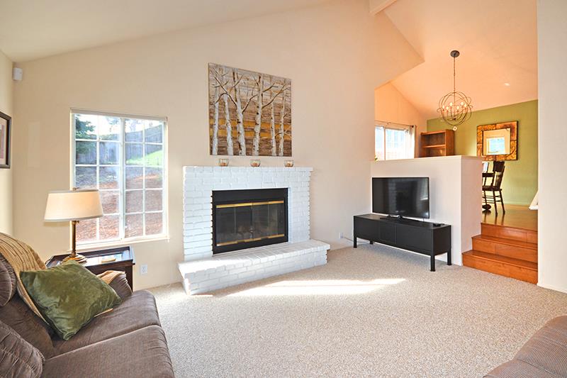 386 Hames Road Corralitos, CA 95076 - Photo 5 of 11 a living room with furniture and a fireplace