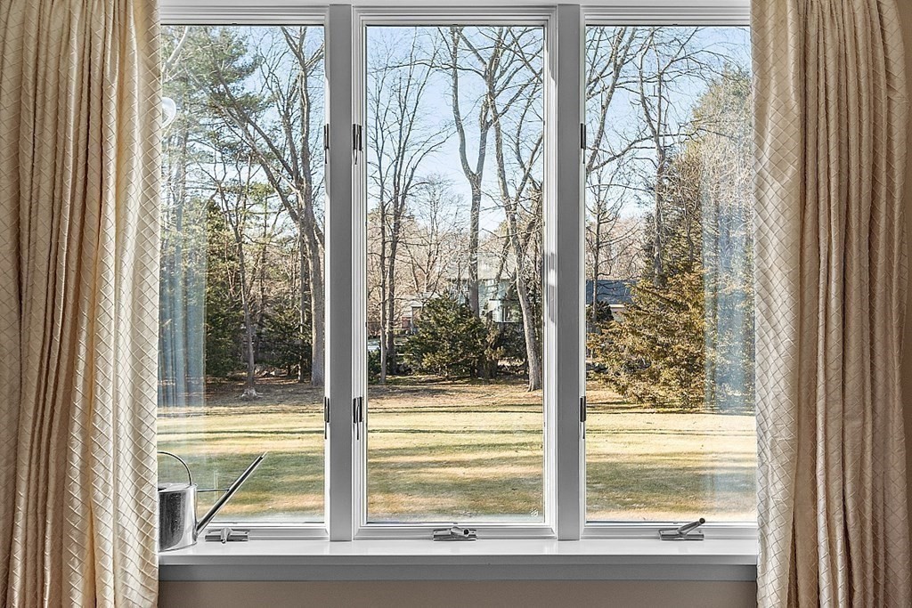 25 Strawberry Hill Road Andover, MA 01810 - Photo 12 of 38 a view of a room with a large window and wooden floor