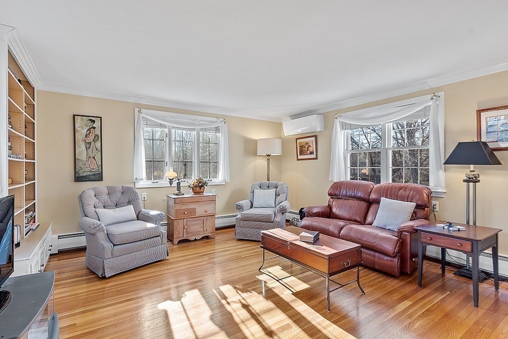 25 Strawberry Hill Road Andover, MA 01810 - Photo 13 of 38 a living room with furniture and a large window