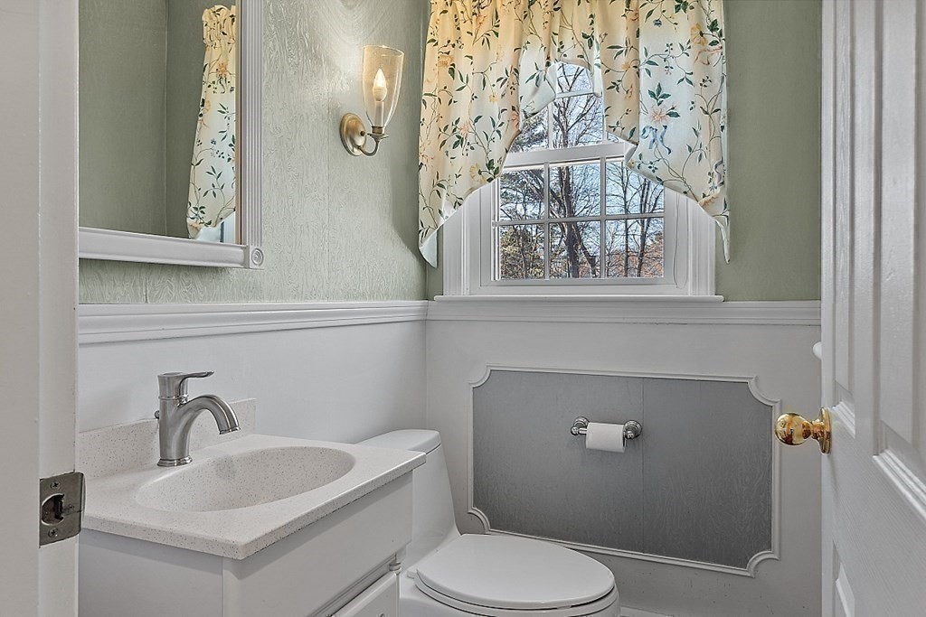 25 Strawberry Hill Road Andover, MA 01810 - Photo 23 of 38 a bathroom with a toilet and a sink