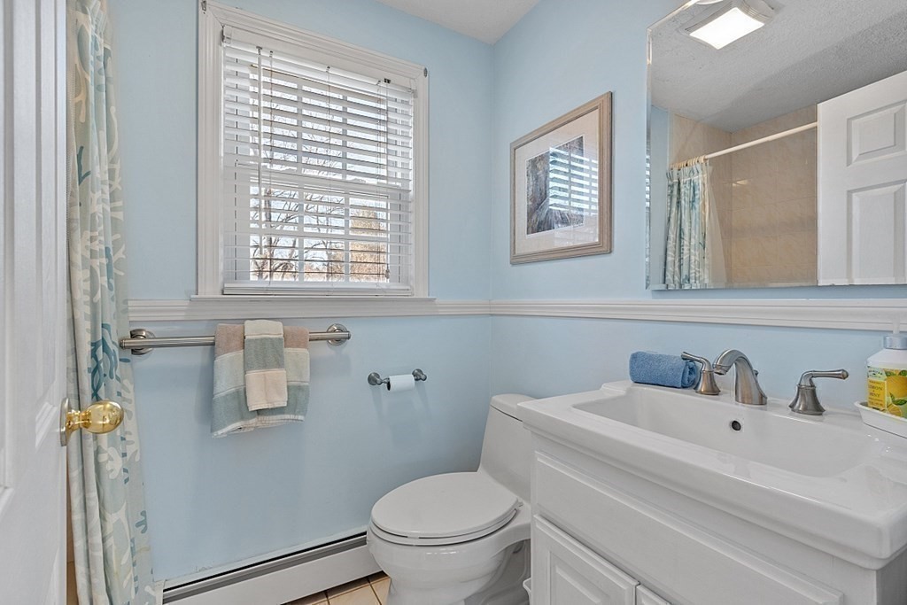 25 Strawberry Hill Road Andover, MA 01810 - Photo 25 of 38 a bathroom with a toilet and a sink