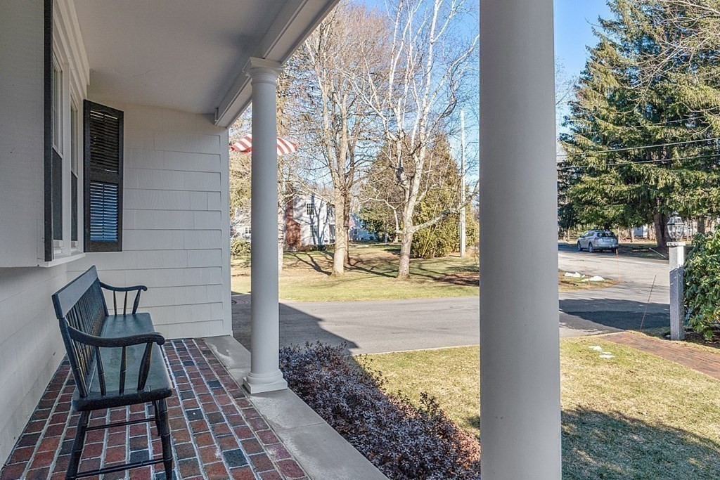 25 Strawberry Hill Road Andover, MA 01810 - Photo 7 of 38 a view of a balcony with chair and table