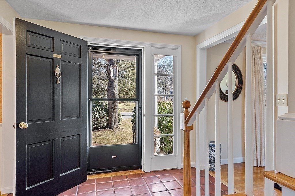 25 Strawberry Hill Road Andover, MA 01810 - Photo 9 of 38 a view of an entryway with a door and a bath tub