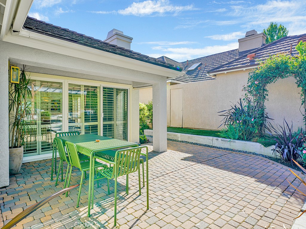 24941 Danamaple Dana Point, CA 92629 - Photo 12 of 32 a patio with yard glass top table and chairs