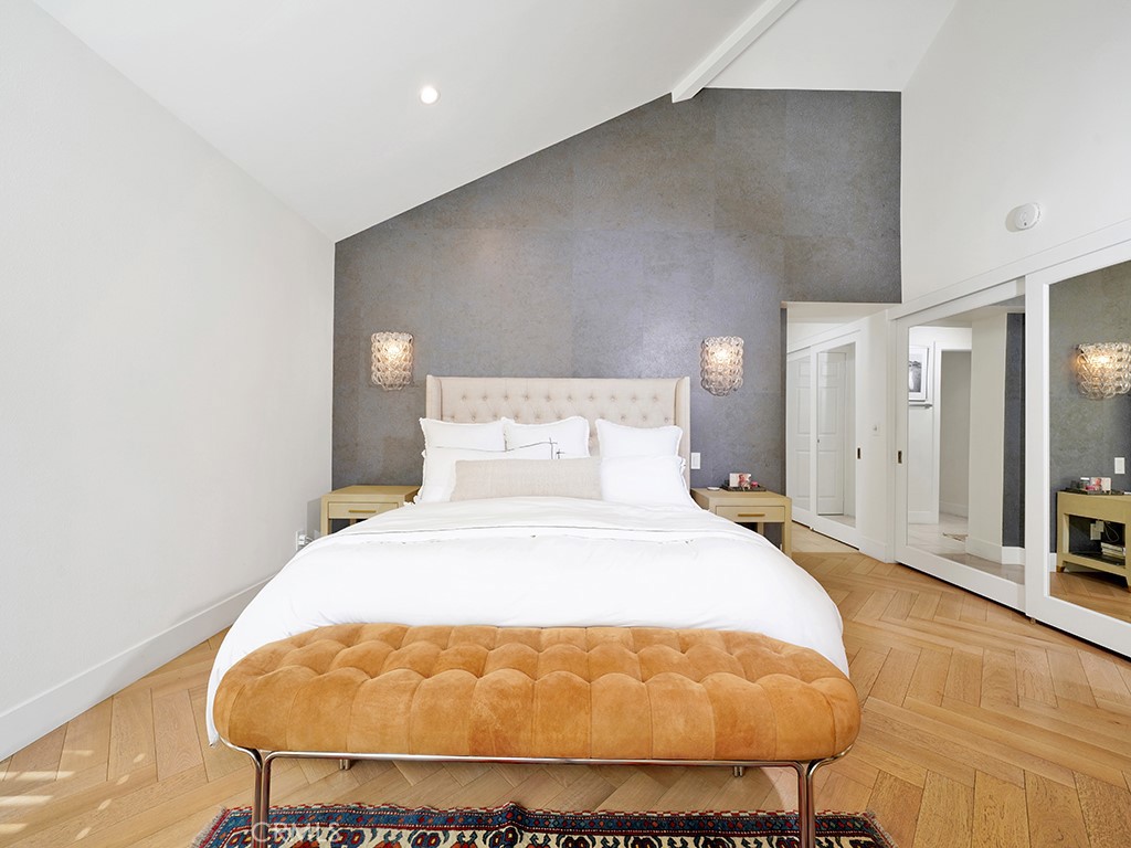 24941 Danamaple Dana Point, CA 92629 - Photo 15 of 32 a bed room with a bed and a chair