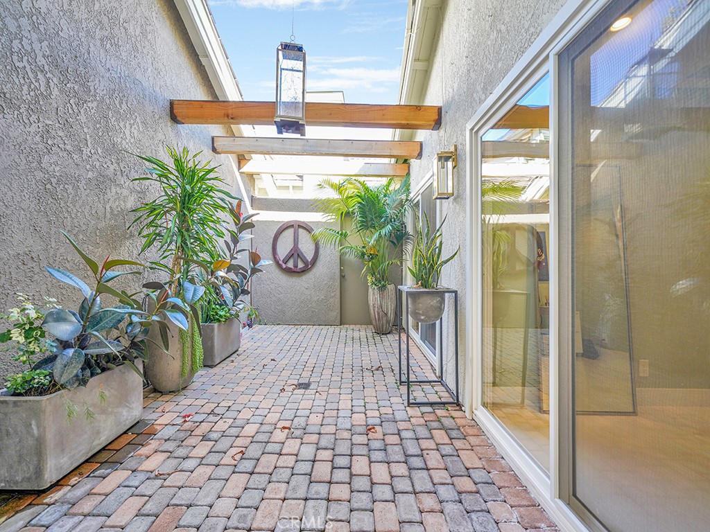 24941 Danamaple Dana Point, CA 92629 - Photo 18 of 32 a porch with glass door and glass table