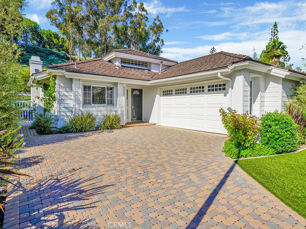 24941 Danamaple Dana Point, CA 92629 - Photo 2 of 32 a front view of a house with a yard and potted plants