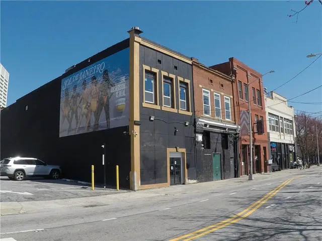 a front view of a building with street view
