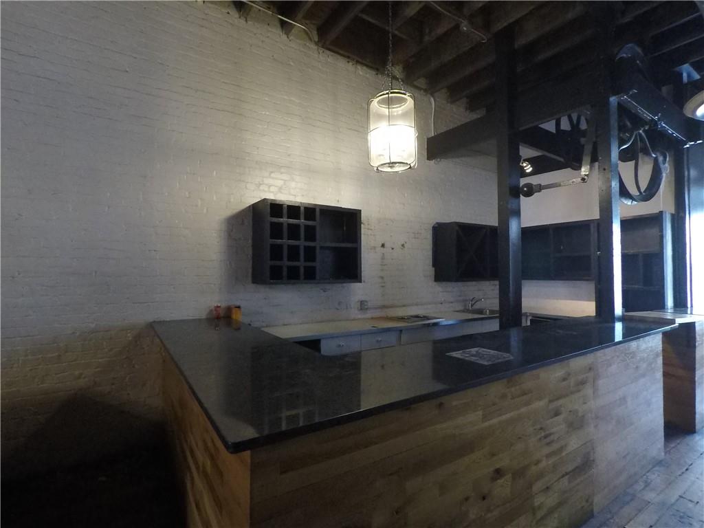 251 Trinity Avenue Southwest Atlanta, GA 30303 - Photo 18 of 32 a view of empty room with wooden floor