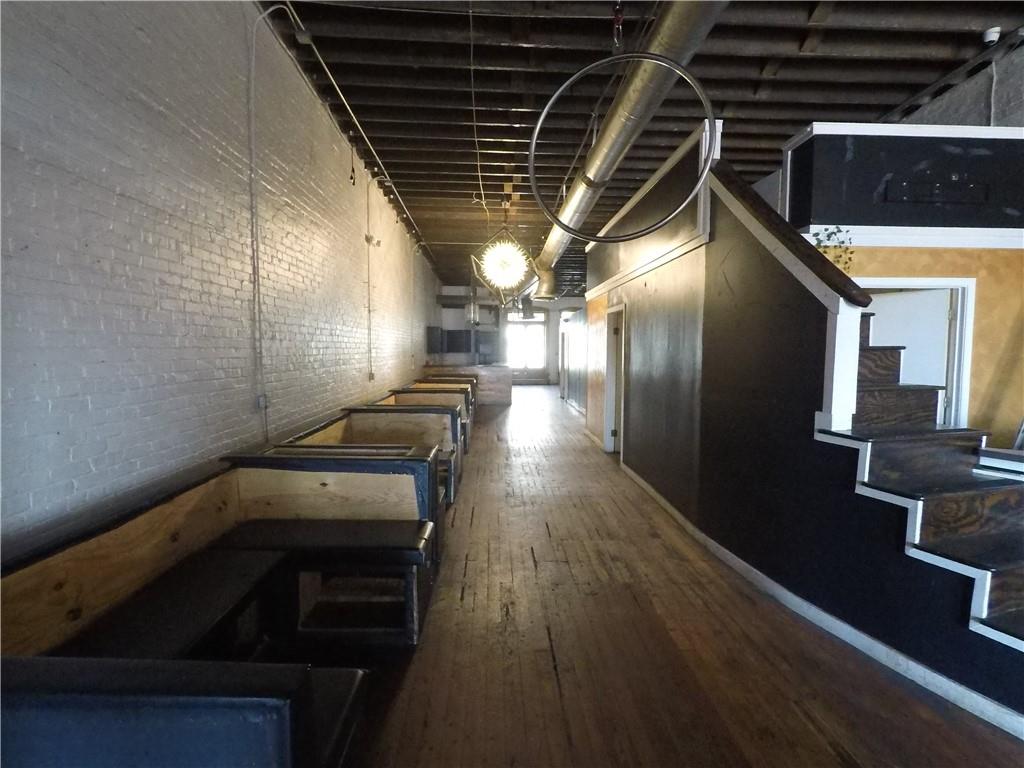 251 Trinity Avenue Southwest Atlanta, GA 30303 - Photo 20 of 32 a view of a hallway with wooden floor